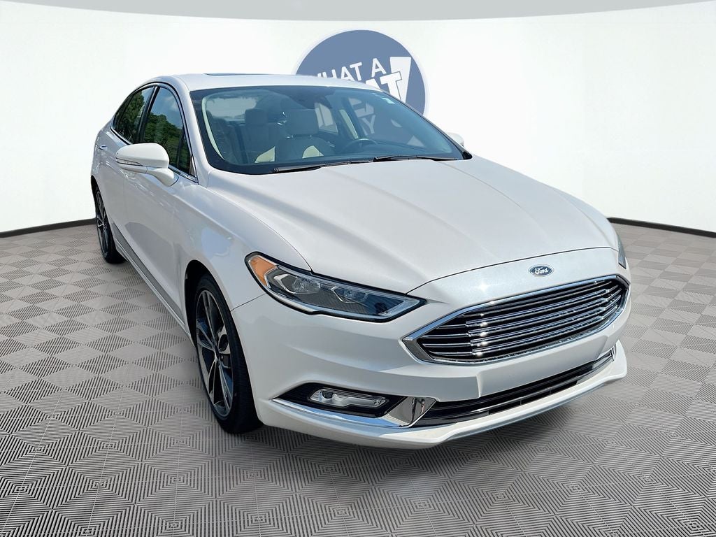 2017 Ford Fusion Titanium in White Platinum Clearcoat Metallic — front three-quarter view