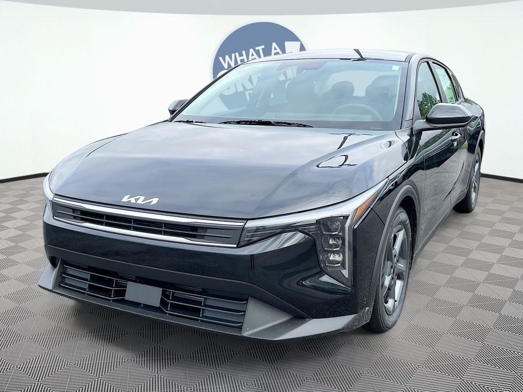 2026 Kia K4 LXS in Aurora Black Pearl — front three-quarter view
