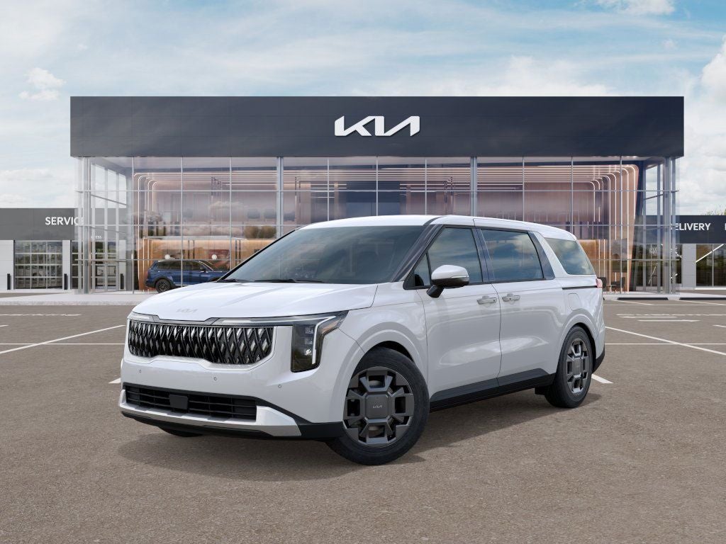 2026 Kia Carnival Hybrid EX in Snow White Pearl — front three-quarter view